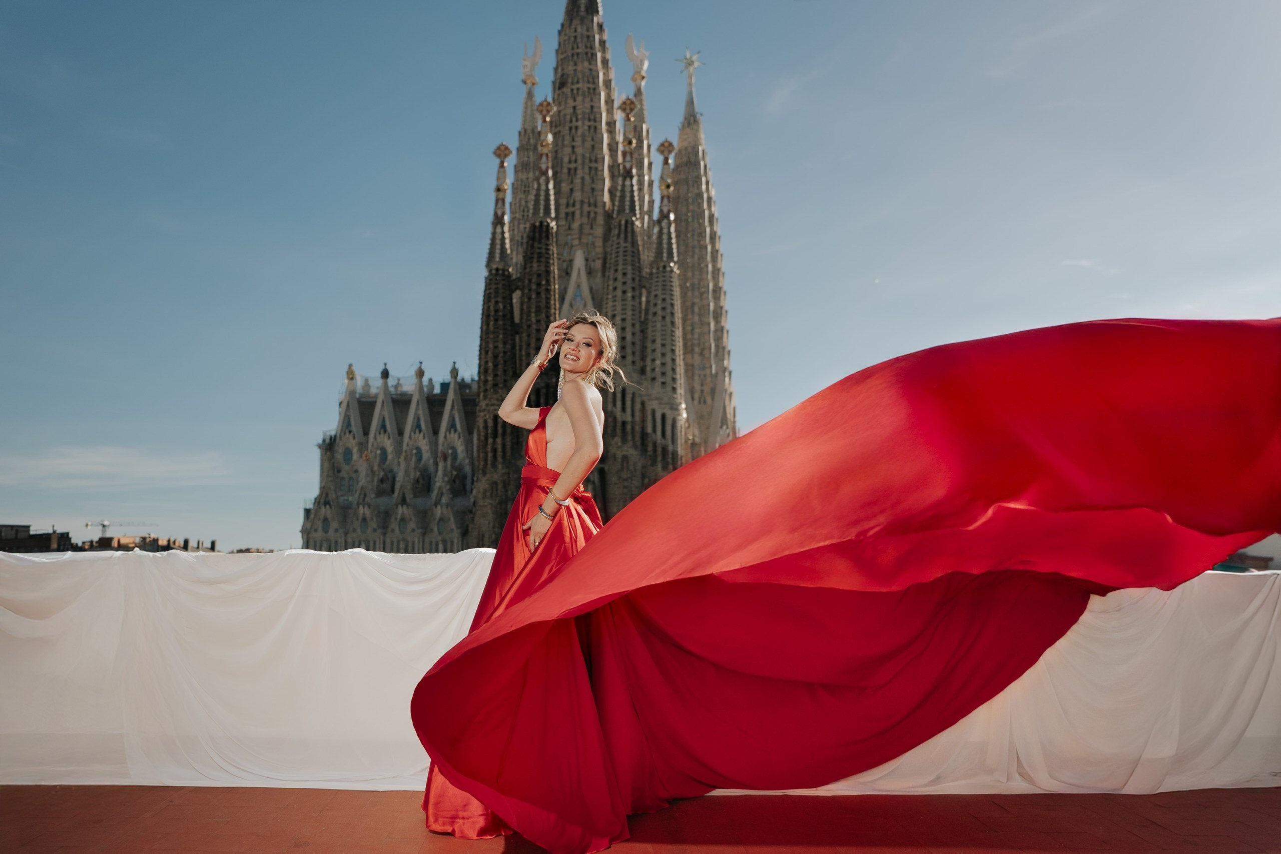 Red flying dress portrait by Sagrada Família